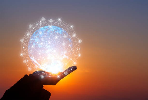 A hand holding a glowing ball of light